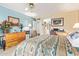 Bright bedroom featuring a ceiling fan, dresser, and desk space at 19093 N 97Th Ln, Peoria, AZ 85382