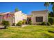 Charming home exterior with a well-manicured lawn and desert landscaping at 19093 N 97Th Ln, Peoria, AZ 85382