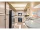 Traditional kitchen featuring stainless steel appliances, granite countertops, and ample cabinet space at 19093 N 97Th Ln, Peoria, AZ 85382