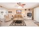 Warm and inviting living room with tile floors, comfortable seating, and neutral tones at 19093 N 97Th Ln, Peoria, AZ 85382