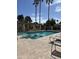 Community pool with lounge chairs provides a perfect spot for relaxation and recreation at 19093 N 97Th Ln, Peoria, AZ 85382