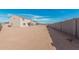 Large backyard with block fence and covered patio, perfect for outdoor enjoyment and privacy at 1997 E Brooklyn Dr, Casa Grande, AZ 85122