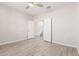 Bedroom with tile floors and a hallway leading to the staircase at 1997 E Brooklyn Dr, Casa Grande, AZ 85122