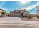 Charming two-story home featuring a three-car garage, desert landscaping and a paver driveway at 1997 E Brooklyn Dr, Casa Grande, AZ 85122