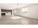 Open-concept living room with wood look tile floors, recessed lighting, a ceiling fan, and a kitchen island at 1997 E Brooklyn Dr, Casa Grande, AZ 85122