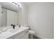 Bright bathroom featuring a modern vanity, sleek fixtures, and tile shower with white tile at 2025 E Campbell Ave # 265, Phoenix, AZ 85016