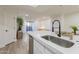 Kitchen island with sink overlooks the open living space at 2025 E Campbell Ave # 265, Phoenix, AZ 85016