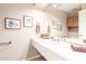 Bathroom featuring a modern sink, light fixtures, and decorative wall art at 20603 N Stonegate Dr, Sun City West, AZ 85375