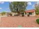 Well-maintained front yard with desert landscaping and a mature tree, enhancing the curb appeal of this lovely home at 20603 N Stonegate Dr, Sun City West, AZ 85375