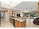 Open kitchen with granite countertops, a breakfast bar, and a view into the Gathering room at 20603 N Stonegate Dr, Sun City West, AZ 85375