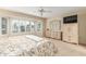 Inviting main bedroom with plantation shutters, ceiling fan, and carpeted flooring at 20603 N Stonegate Dr, Sun City West, AZ 85375