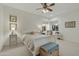 Cozy bedroom with a ceiling fan, a decorative bed, and lots of natural light at 25409 N Ranch Gate Rd, Scottsdale, AZ 85255