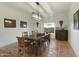 Well-lit dining room features terra cotta floors and classic furnishings at 25409 N Ranch Gate Rd, Scottsdale, AZ 85255