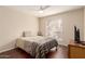 Bedroom featuring wood-look floors, ceiling fan and neutral paint at 2625 E Indian School Rd # 240, Phoenix, AZ 85016