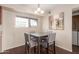 Dining area with a square table, comfortable seating, and a window with natural light at 2625 E Indian School Rd # 240, Phoenix, AZ 85016