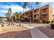 Exterior of building with a sidewalk and common area seating and landscaping at 2625 E Indian School Rd # 240, Phoenix, AZ 85016