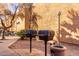 Outdoor BBQ area with grills, ideal for community gatherings and cookouts at 2625 E Indian School Rd # 240, Phoenix, AZ 85016