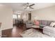 Comfortable living area featuring a gray sofa and chair, with stylish decor and wood flooring at 2625 E Indian School Rd # 240, Phoenix, AZ 85016