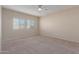 Empty bedroom with carpet and window at 274 W Kona Dr, Casa Grande, AZ 85122