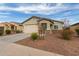 Single-story home featuring a two-car garage and desert landscaping at 274 W Kona Dr, Casa Grande, AZ 85122