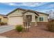 Single-story home featuring a two-car garage and desert landscaping at 274 W Kona Dr, Casa Grande, AZ 85122