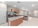 Open concept kitchen with stainless steel appliances and island at 274 W Kona Dr, Casa Grande, AZ 85122