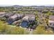 Stunning aerial view of a desert home in a lush community with mountain views at 29816 N 129Th Gln, Peoria, AZ 85383