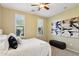 This bright bedroom is decorated with neutral tones, bright windows, carpeted floors and ample light at 29816 N 129Th Gln, Peoria, AZ 85383