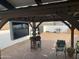 Relaxing backyard patio with an outdoor kitchen, television, grill, and desert views at 32628 N 163Rd Ave, Surprise, AZ 85387