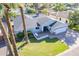 Desirable home featuring a manicured lawn, mature trees, and neutral exterior paint at 4241 E Montecito Ave, Phoenix, AZ 85018