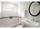 Inviting bathroom featuring a modern vanity, ample lighting, and a stylish subway tile at 4241 E Montecito Ave, Phoenix, AZ 85018