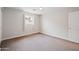 Carpeted bedroom with neutral walls, offering a serene atmosphere at 4241 E Montecito Ave, Phoenix, AZ 85018