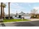 Inviting single-story home with lush green lawn and brick driveway leading to the two-car garage at 4241 E Montecito Ave, Phoenix, AZ 85018