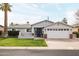 Charming single-story home features a manicured lawn, brick accents, and a two-car garage at 4241 E Montecito Ave, Phoenix, AZ 85018