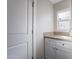 Functional mud room with granite countertop, storage cabinets, and natural light at 4241 E Montecito Ave, Phoenix, AZ 85018