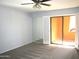 Carpeted bedroom with mirror and shuttered access to an outdoor balcony at 4303 E Cactus Rd # 331, Phoenix, AZ 85032