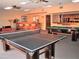 Spacious game room with pool table, ping pong table, seating, and bar area at 4303 E Cactus Rd # 331, Phoenix, AZ 85032