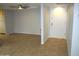 Bright living room with neutral walls, tile flooring, and a ceiling fan at 4303 E Cactus Rd # 331, Phoenix, AZ 85032