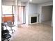 Living room featuring tile floors, fireplace, and shuttered access to outdoor balcony at 4303 E Cactus Rd # 331, Phoenix, AZ 85032