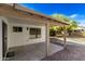 Covered back patio with concrete floor overlooks the backyard and offers an outdoor living space at 4436 W Morrow Dr, Glendale, AZ 85308