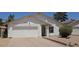 Charming single-story home with a well-maintained front yard and a two-car garage at 4436 W Morrow Dr, Glendale, AZ 85308