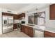 Bright kitchen with stainless steel appliances, ample cabinet space, and a window over the sink at 4436 W Morrow Dr, Glendale, AZ 85308