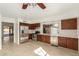 Well-lit kitchen with stainless steel appliances, dark wood cabinets, and bright white tile backsplash at 4436 W Morrow Dr, Glendale, AZ 85308