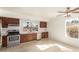 Bright kitchen features stainless steel appliances, tile floors and a window over the sink with a view at 4436 W Morrow Dr, Glendale, AZ 85308