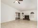 Spacious living room featuring tile flooring, a cozy fireplace, and a sliding door to the backyard at 4436 W Morrow Dr, Glendale, AZ 85308