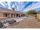 Extensive backyard featuring an outdoor kitchen, tiled patio, seating area, and sparkling pool at 4514 E Mazatzal Dr, Cave Creek, AZ 85331