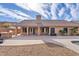 Expansive backyard showcasing an outdoor kitchen, tiled patio, and access to the refreshing pool at 4514 E Mazatzal Dr, Cave Creek, AZ 85331