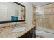 Bathroom showcasing a granite countertop, vanity, and tiled shower, designed for functionality and style at 4514 E Mazatzal Dr, Cave Creek, AZ 85331