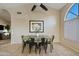 Cozy dining area with a modern table and chairs, adjacent to a large window at 4514 E Mazatzal Dr, Cave Creek, AZ 85331