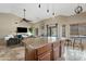 Spacious kitchen featuring an island, modern pendant lighting, and an open layout flowing into the living area at 4514 E Mazatzal Dr, Cave Creek, AZ 85331